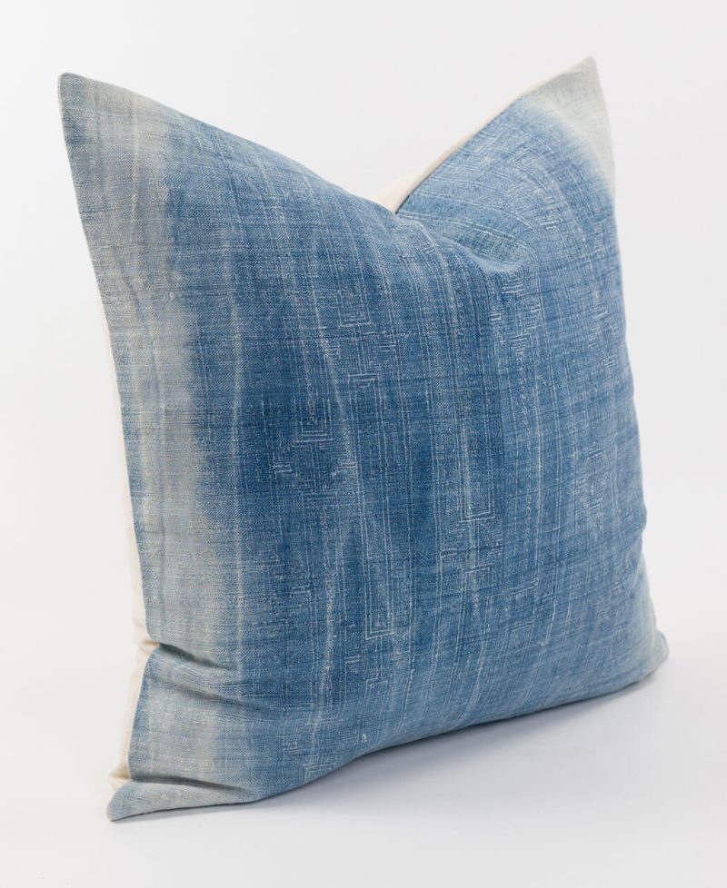 A boho accent cushion with indigo blue color.