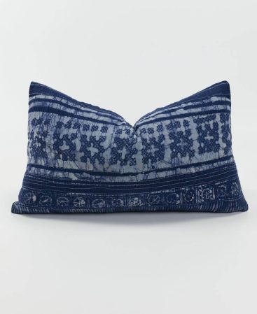 A colorful accent pillow with violet and purple indigo tones.