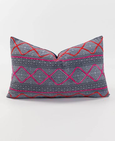 A colorful embroidered tribal throw cushion.
