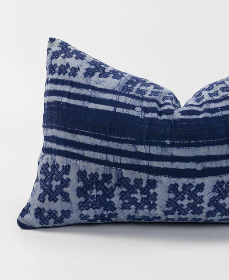 A colorful pillow case featuring purple indigo dyes.