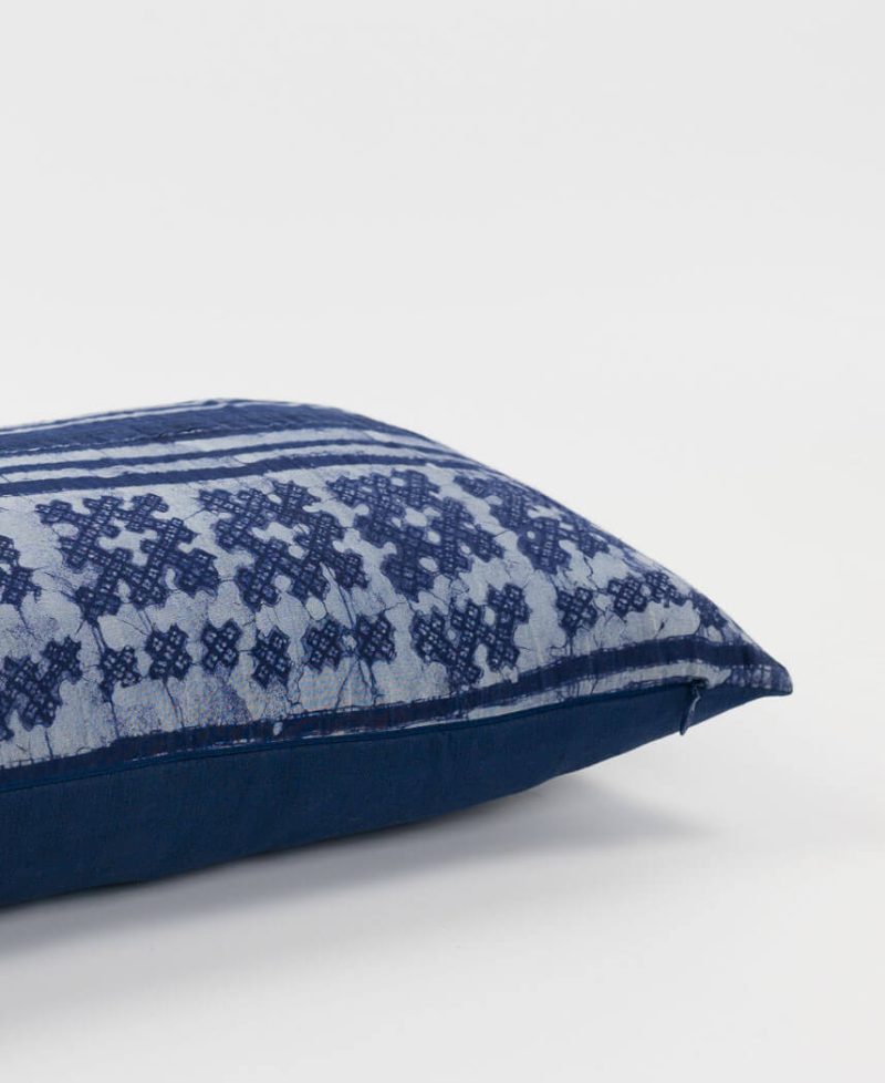 A cushion cover finished with an invisible zip enclosure.