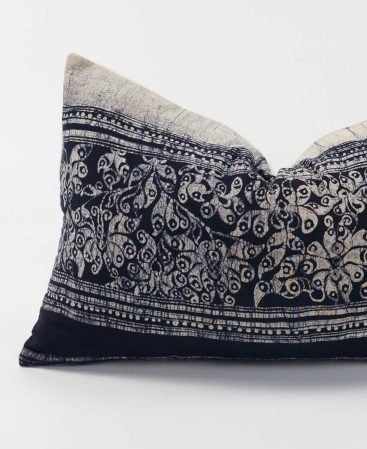 A cushion with multiple shades of gray.