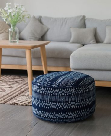 A floor cushion with geometric patterns and design.