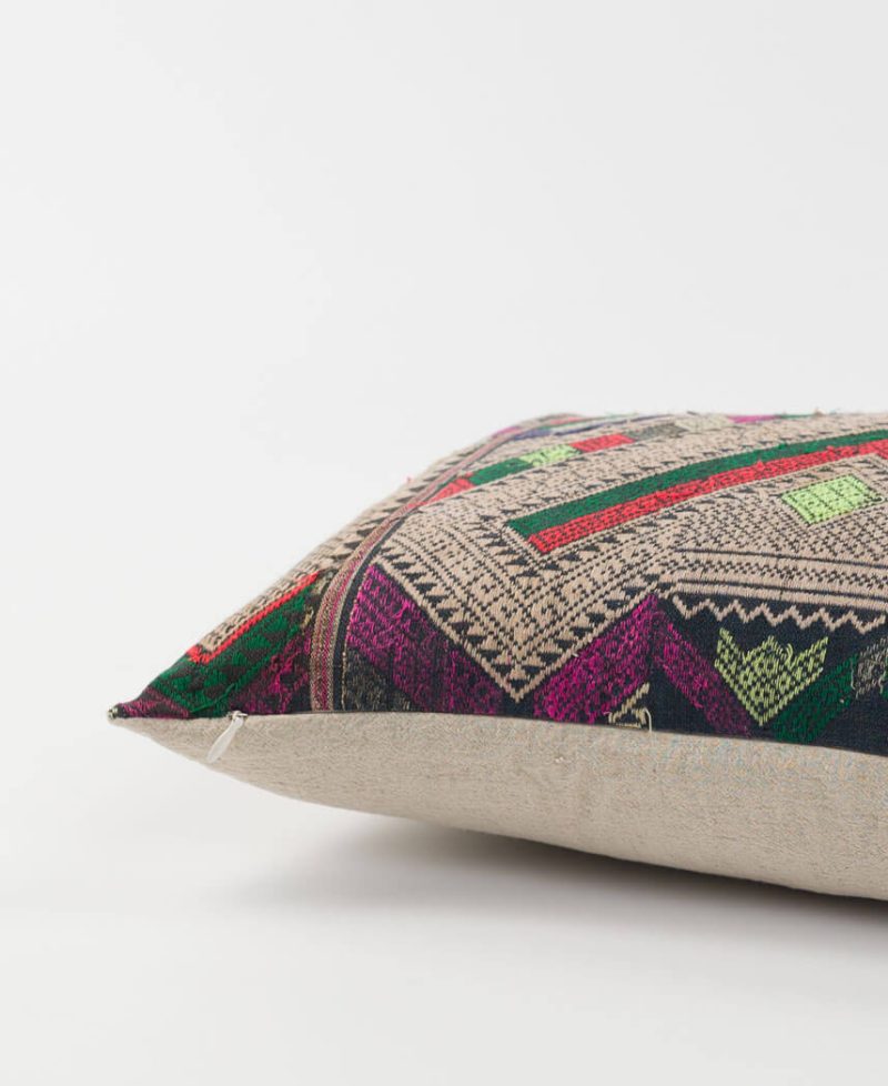 A linen backed pillow cover that features ethnic hill tribe textiles.