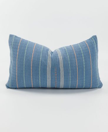 A loom-woven pastel blue cushion cover.