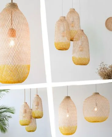A mix of natural wood and yellow color pendant lighting shades in various sizes.
