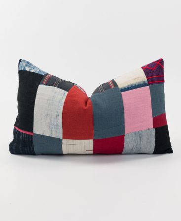 A patchwork cushion made up of various hill tribe textiles.