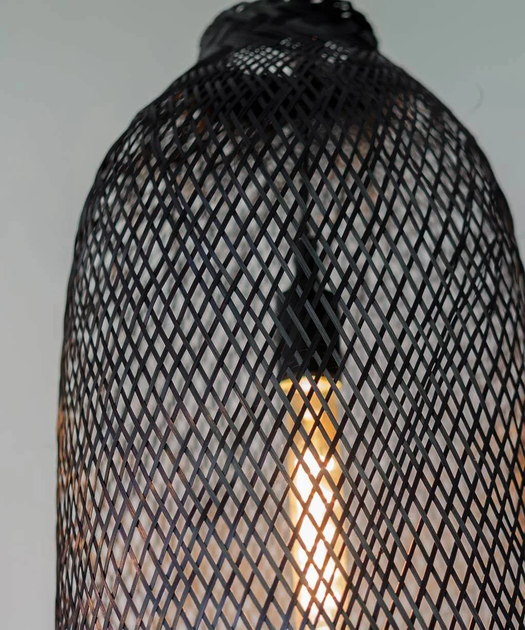 A tall black light fixture with long Edison bulb inside.