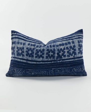 A unique purple accent cushion with tons of ethnic style.