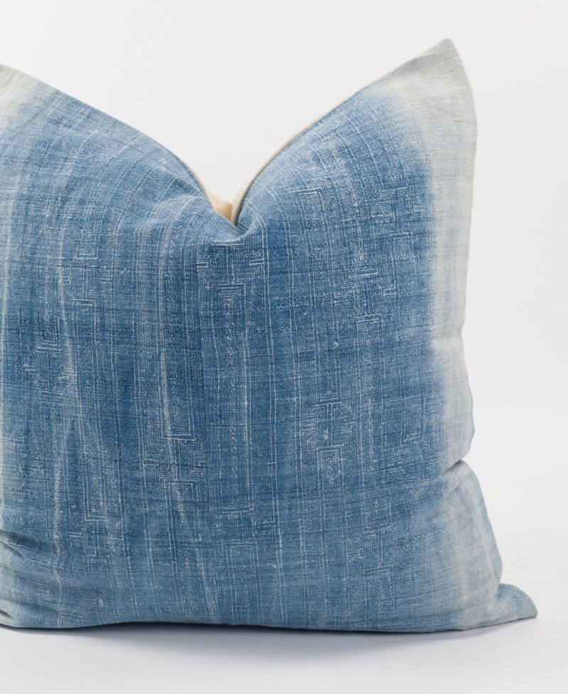 A vintage accent cushion with ethnic vibes.