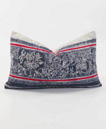 A vintage hill tribe cushion with red stripes.