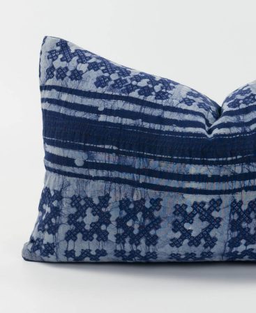 A violet color cushion cover made using ethnic textiles.