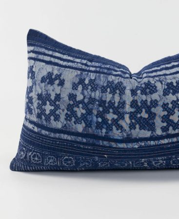 A violet pillow case made using tribal fabric.
