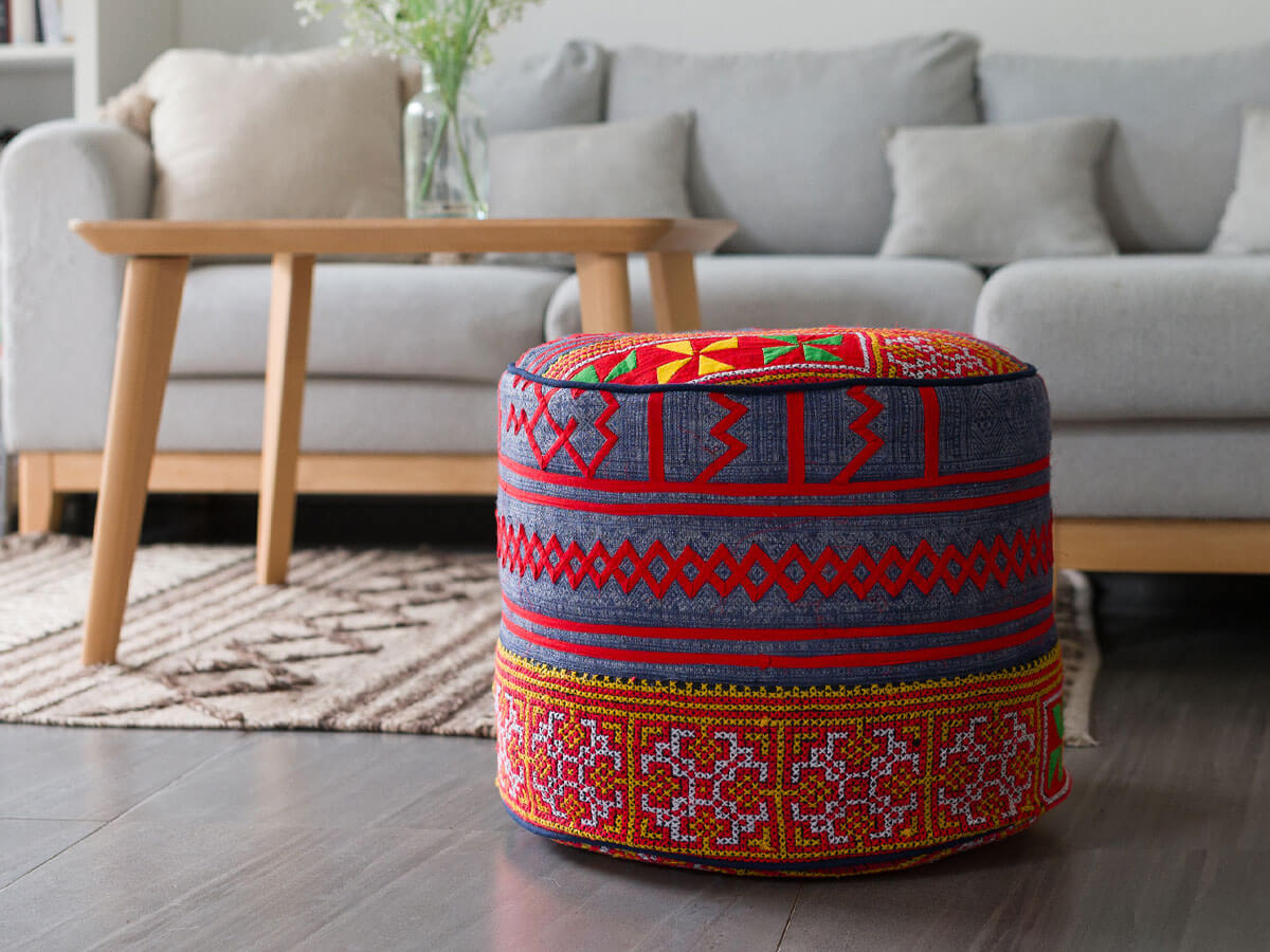 An ethnic ottoman made from embroidered tribal textiles.