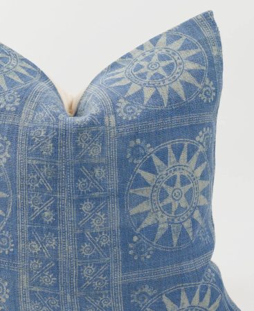 An ethnic pillow cover with indigo batik designs.