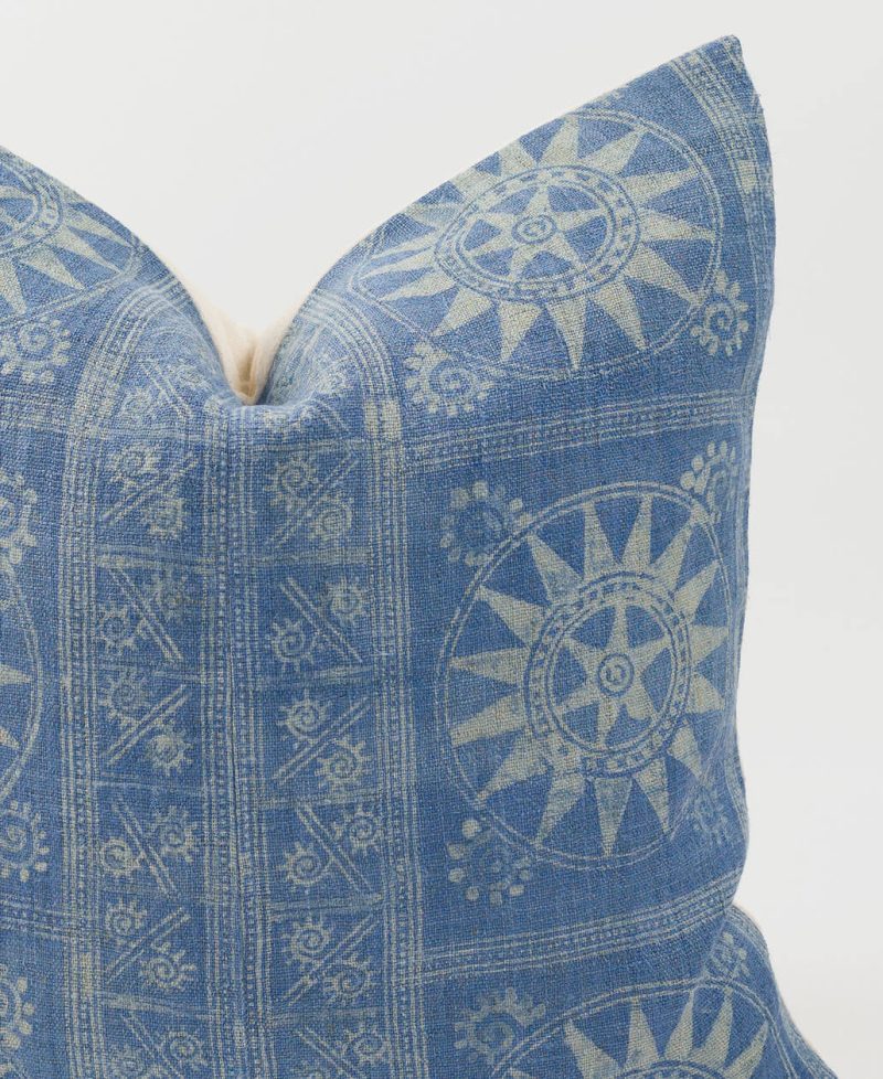 An ethnic pillow cover with indigo batik designs.