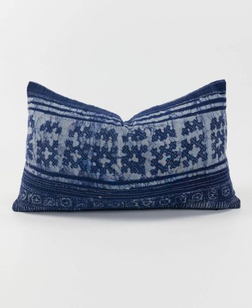 An indigo and violet pillow cover.