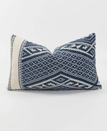 An indigo dyed, kilim cushion in blue and white color.