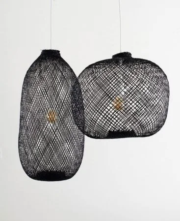 Black bamboo pendant lights in tall and round shapes.