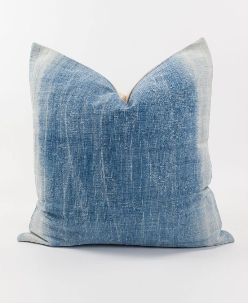 Boho indigo cushion with white stripes.