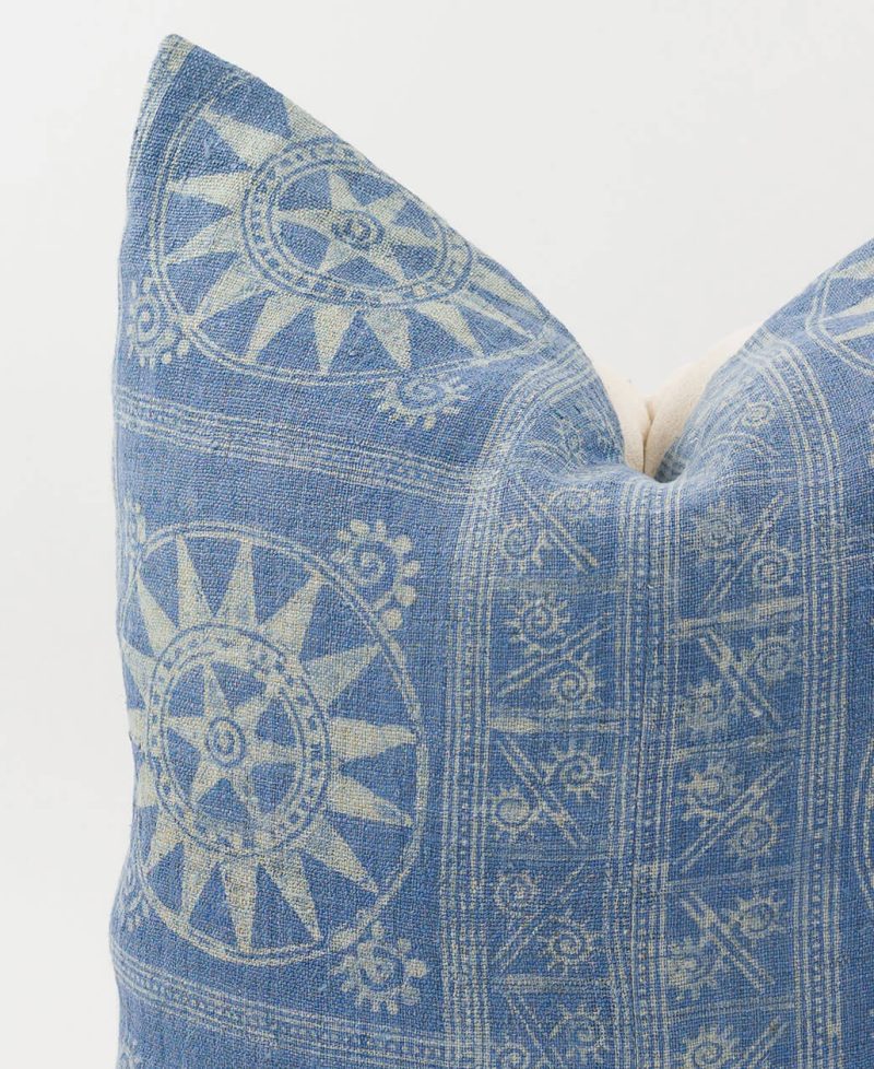 Close up view of ethnic fabric on a unique pillow cover.