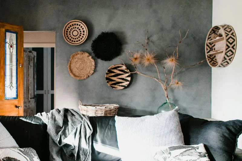 Ethnic wall art pieces in black and natural tones.