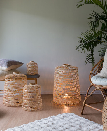 Four large bamboo baskets with an oversized wood floor lamp.