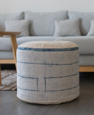 Indigo dye staining on this ottoman gives it a unique look.