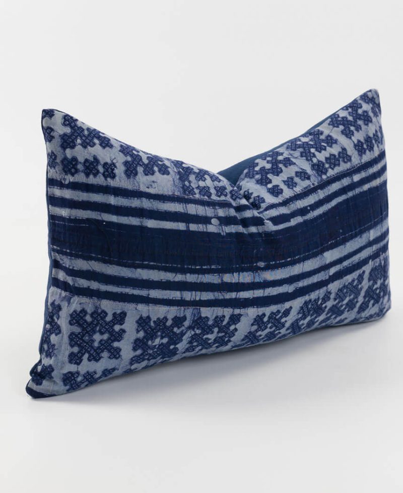 Light and dark purple indigo hues are visible on this cushion cover.