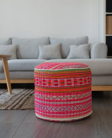 Light colored pink and white ottoman made from ethnic hill tribe dress fabric.