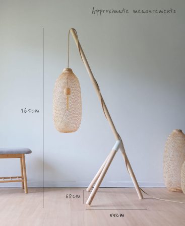 Close-up of natural light-toned wood grain on tripod floor lamp leg