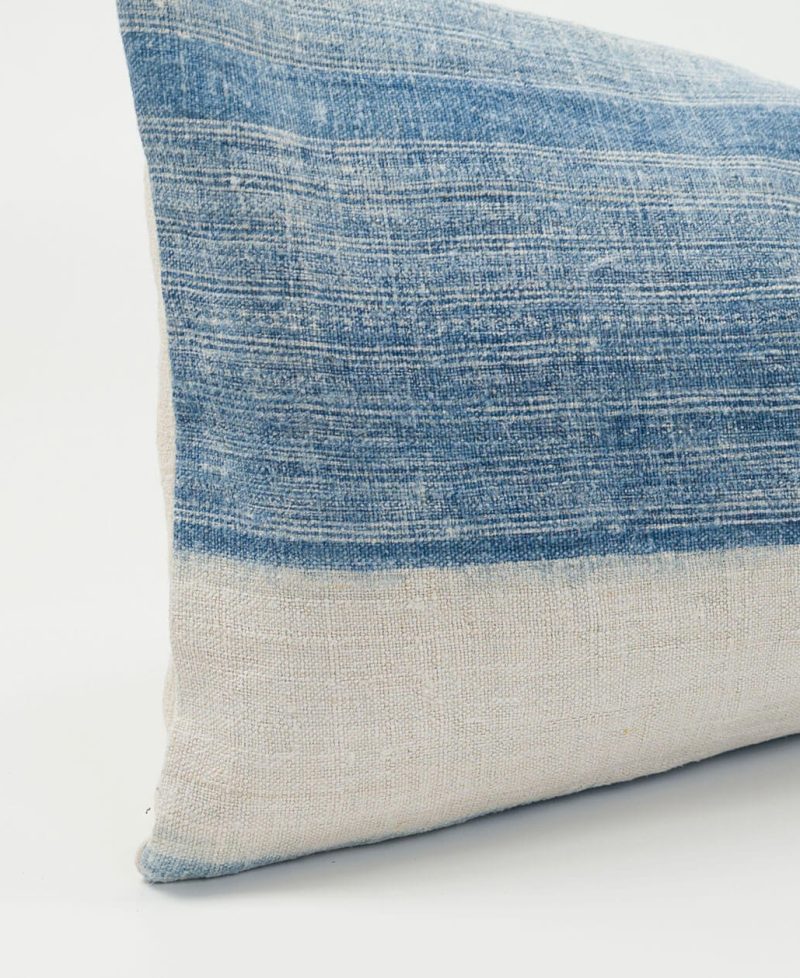 Rare textiles from ethnic communities repurposed into indigo lumbar cushions.