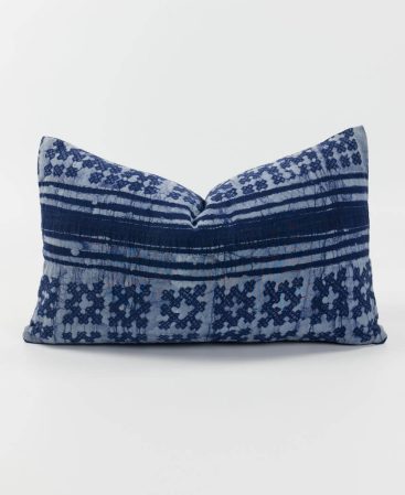 Rare tribal textiles feature on this purple accent pillow.