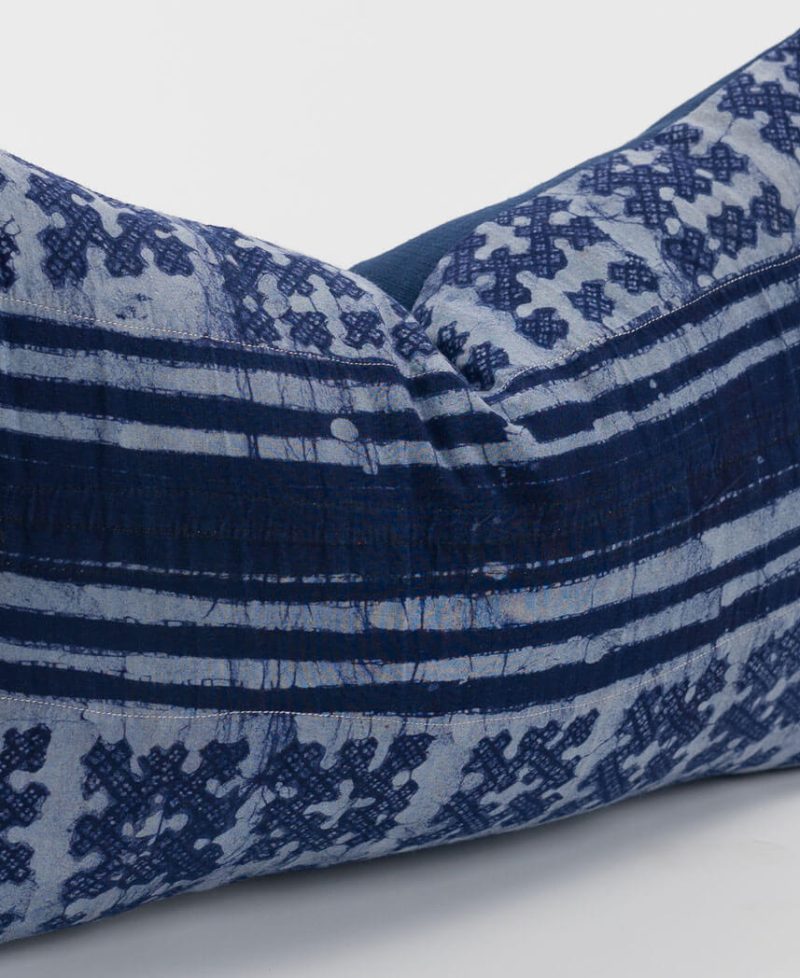 Rich purple tones give this cushion an elegant and royal feel.