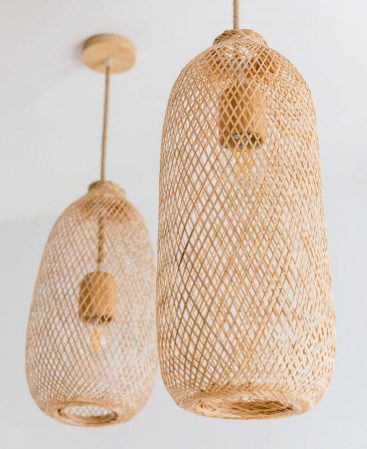 Rustic bamboo rattan pendant light fixtures with rope light cords.