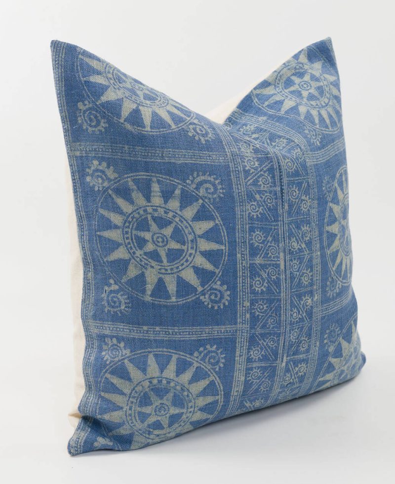 Side view of a pillow cover featuring ethnic tribal textiles.