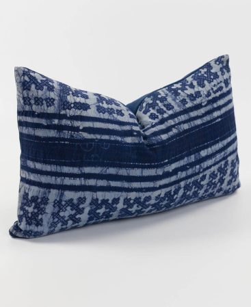 Side view of a tribal cushion with violet indigo hues.