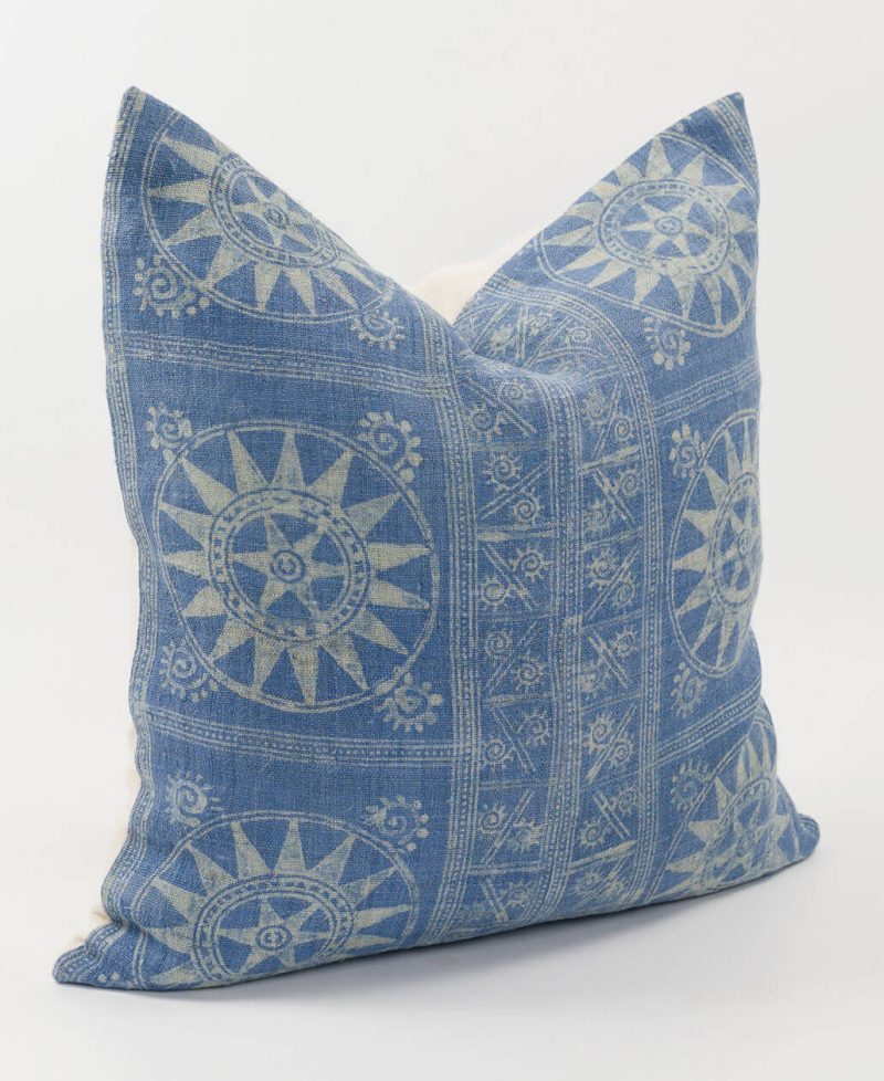 Side view of a unique pillow cover made from vintage textiles.