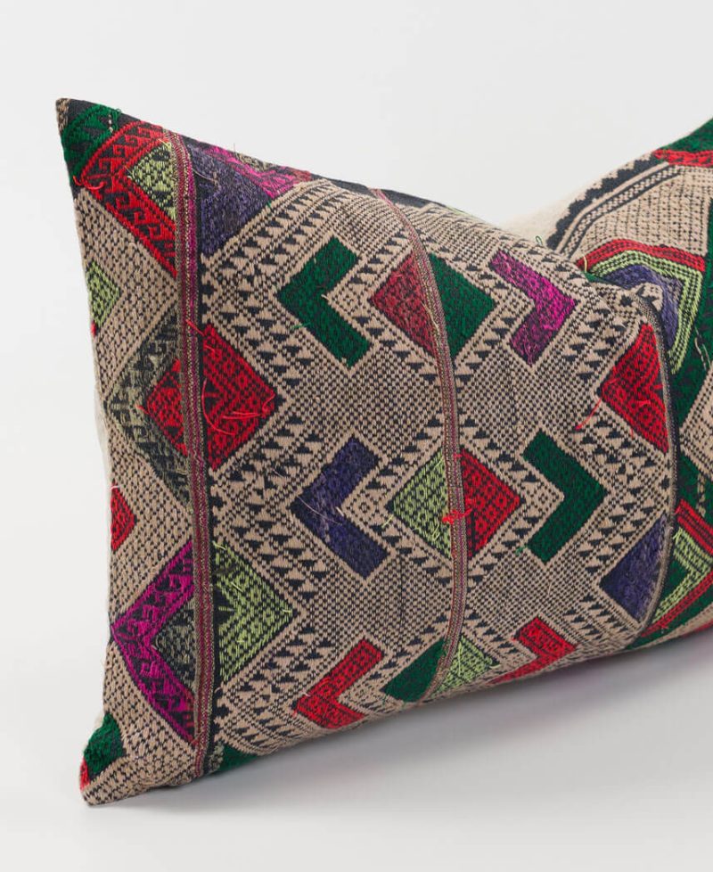 Silk and cotton threads on a vintage throw cushion.