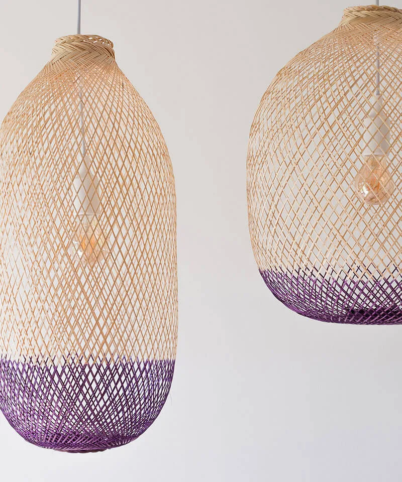 Subdued light fixtures with soft wood hues and dark purple colored lower sections.