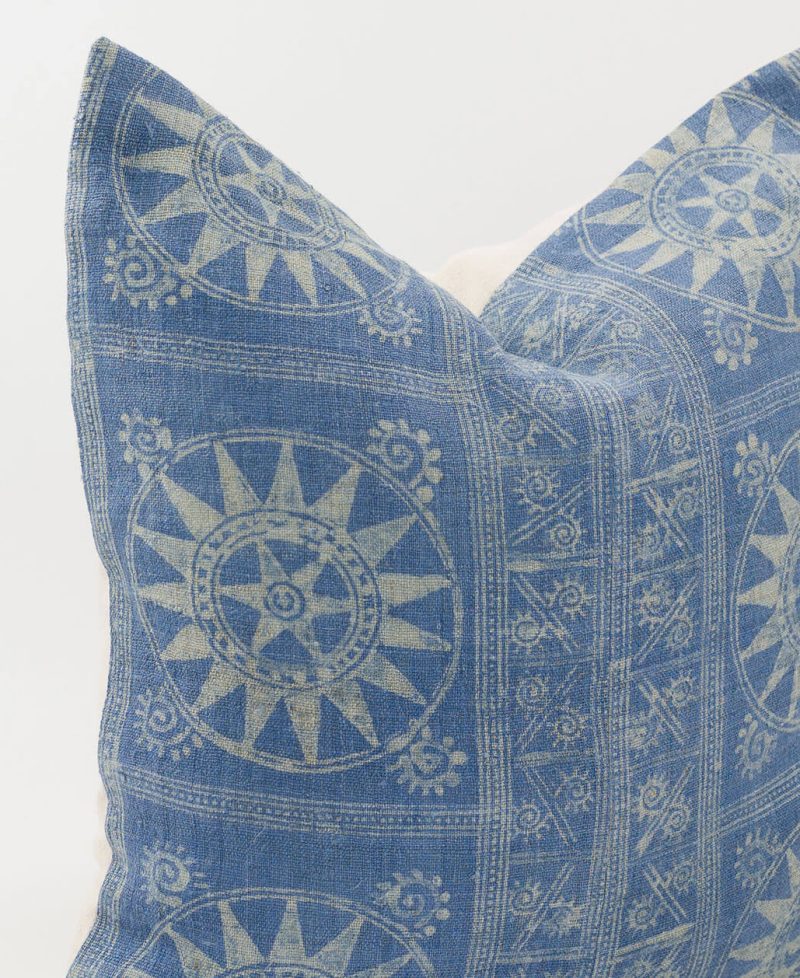 Sun motifs made with indigo batik methods.