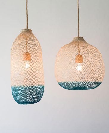 Turquoise and teal pendant light fixtures featuring natural wood and local dyes.