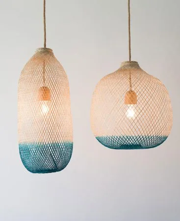 Turquoise and teal pendant light fixtures featuring natural wood and local dyes.