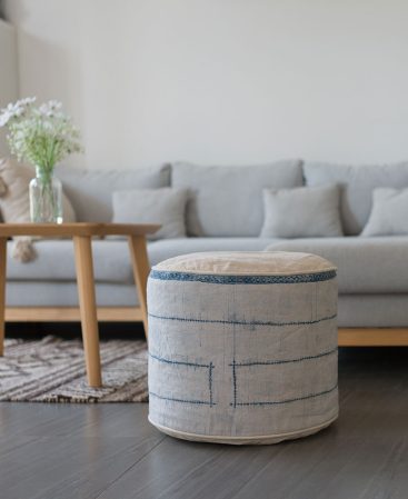 White and cream ottoman pouf made from vintage hill tribe fabric.