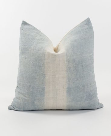 Worn and rustic light blue striped cushion cover.