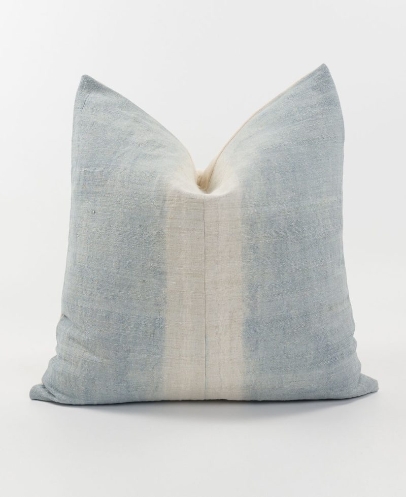 Worn and rustic light blue striped cushion cover.