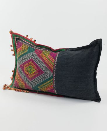 Worn and weathered vintages textiles can be upcycled into cushions and pillows like this.