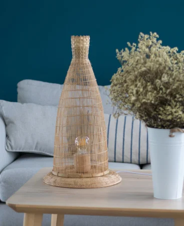 Slim and tall woven bamboo rattan table lamp.