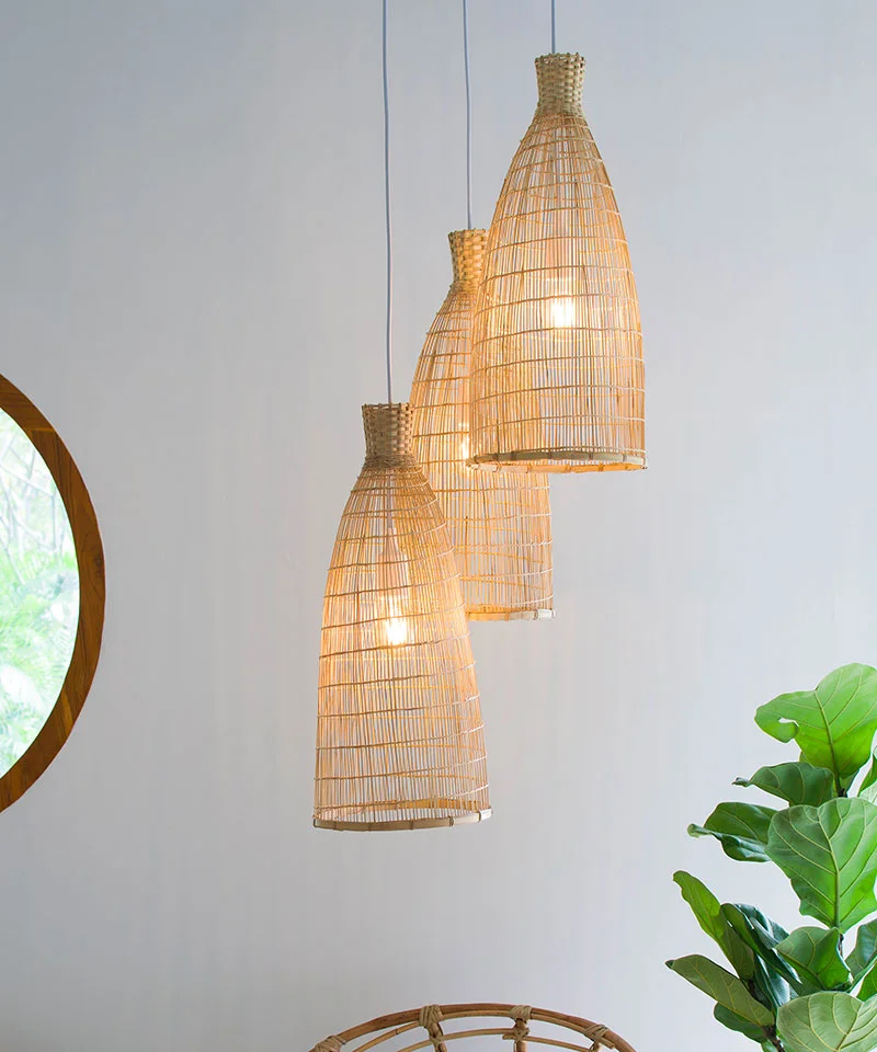A Set of Bamboo Pendant Lights Suspended On A White Pendant Cluster Setup